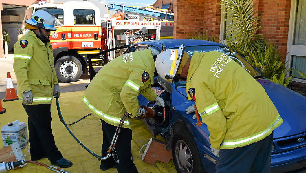 The crew uses an old car to practice techniques of how to remove passengers from a car in a crash scenario. The crew uses an old car to practice techniques of how to remove passengers from a car in a crash scenario.